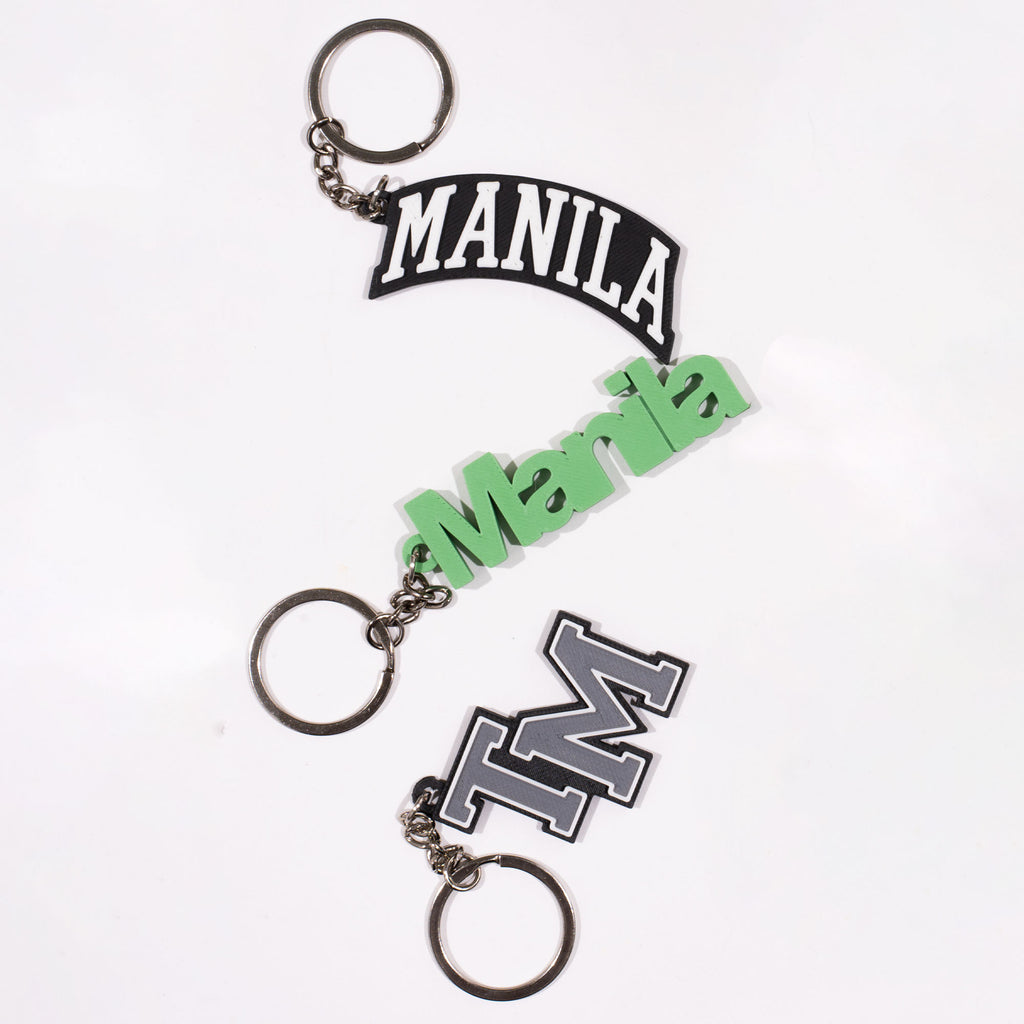 TEAM MANILA ACADEMIC KEYCHAIN BLACK